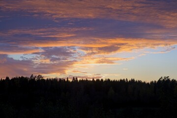 Magical sunset in winter in January over Bredebolet in Skaraborg in Vaestra Goetaland in Sweden on a cold day