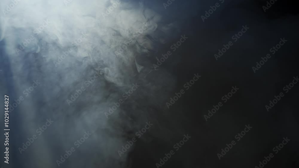 Wall mural soft diffused rays of light cut through the hazy darkness.