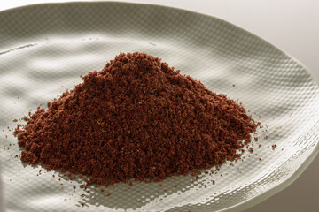 high resolution macro photography of dried and ground sumac seeds, a ready-made spice