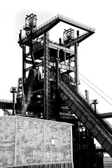 Historic blast furnace plant in Dortmund-Hörde. Silhouette of the complex steel construction in...