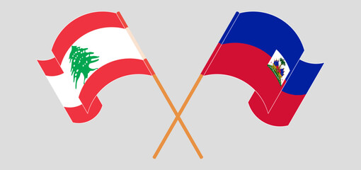 Crossed and waving flags of the Lebanon and Republic of Haiti. Vector illustration