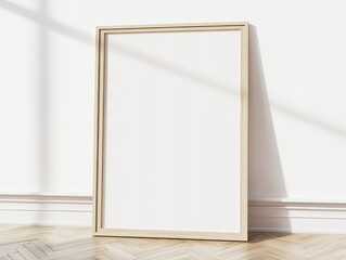 A simple wooden frame leaning against a white wall with sunlight casting shadows.