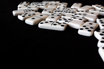 Domino tiles on black background with space for text.