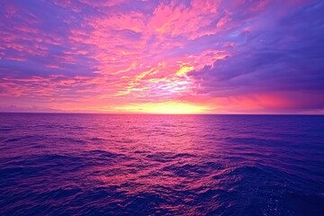 Naklejka premium Breathtaking sunset over tranquil ocean waves paints the sky in hues of purple and orange