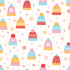 Colourful seamless pattern with cute hand drawn winter hats. Christmas background concept. Vector illustration