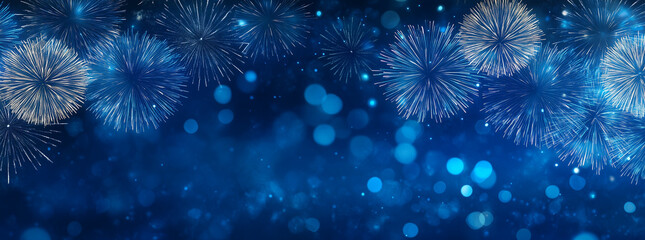 Blue fireworks against a dark blue sky background with copy space, a banner design. New year celebration concept.