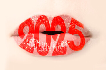 2025 written with red lipstick on girl lips