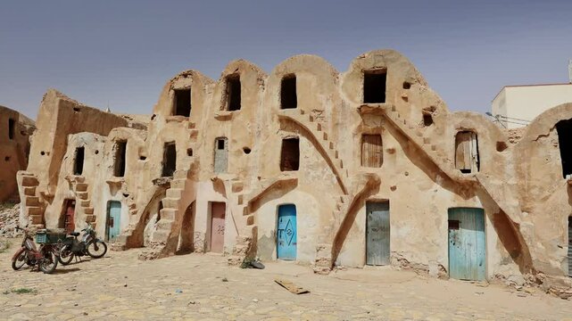 Fortified village with houses and granaries, sights of Tunisia. Ksar of Medenine, Berber, Tataouine. Uncomplicated and simple village architecture of ancient Muslim tribes, Tunisian Berbers 