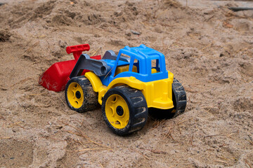 Toy tractor int the sand