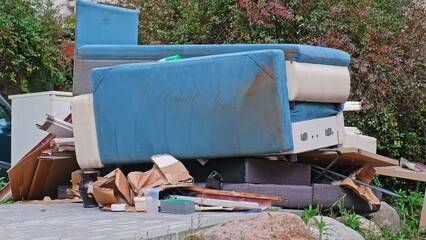 Old Furniture Dumped Outdoor by Street Curb for Kerbside Pickup by City Communal Service for...
