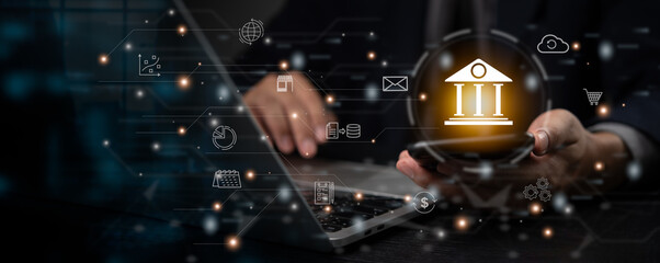 Hand holding a phone displaying a bank icon, representing digital banking and fintech solutions.