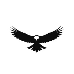 Fototapeta premium A black silhouette of a large eagle with outstretched wings against a white background 