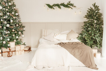 Interior bedrooms in Scandinavian style, decorated for the Christmas holidays. Live ate in the interior.
