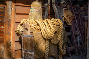 a thick rope lying on an old crate on a farm © Adam