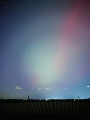 Stunning, dreamy display of vivid colors seen from aurora borealis, northern lights over Long...