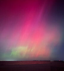 Stunning, dreamy display of vivid colors seen from aurora borealis, northern lights over Long...