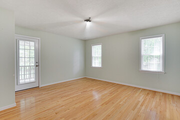 Bright Empty Room With Polished Wooden Floors.