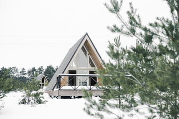 A country house in nature in winter. Rest in an ecologically clean place in winter. Glamping in nature.
