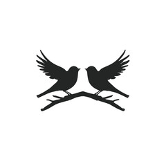 Obraz premium Two black silhouette birds with wings spread, perched on a branch