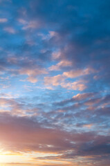 Sunset sky background, picturesque vast sky landscape view, vertical sunset sky with colorful clouds