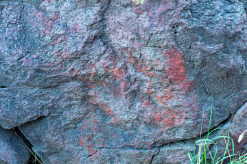 Red and blue textured rock wall