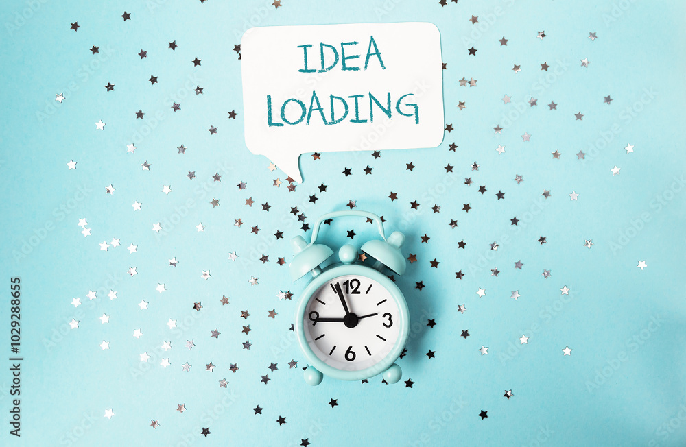 Poster a clock with the words idea loading written above it