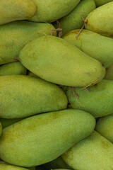 A pile of sweet mangoes sold by a roadside fruit vendor in Lubuklinggau City, Indonesia.