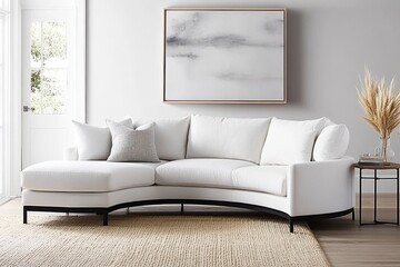 A living room with beige walls, large curved sofas in neutral tones, and a black coffee table.