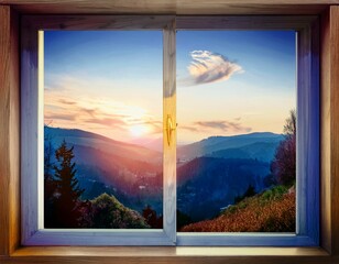 Very nice sunrise seen through the window of a house. You can see large mountains, trees and a lot of green vegetation.