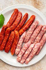 raw meat sausages beef, pork, chicken, lamb, dish fresh delicious gourmet food background on the table rustic food top view copy space