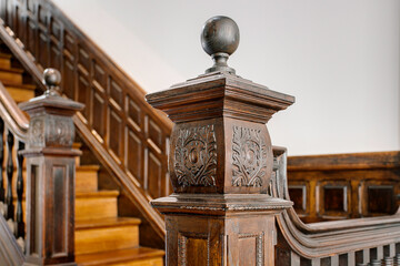 Ornate Wooden Staircase With Intricate Carvings Shown.