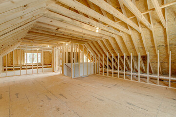 Unfinished Attic With Open Framing And Wooden Beams.