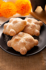Pan de Muerto. Typical Mexican sweet bread that is consumed in the season of the day of the dead. It is a main element in the altars and offerings in the festivity of the day of the dead.