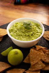 Guacamole. Avocado dip sauce,  one of its many ways of consuming it is spread on tortilla chips also called Nachos. Mexican easy homemade sauce recipe very popular.