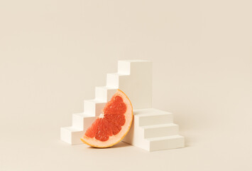 Creative Product Display made with Minimalist Grapefruit Slice on Geometric White Stairs