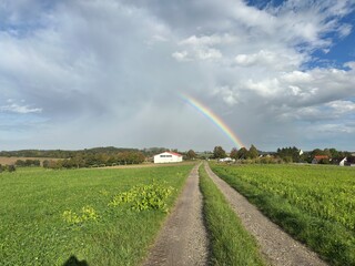 disappearing rainbow over the fields of a German village © Patka