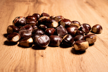 chestnuts on wooden background