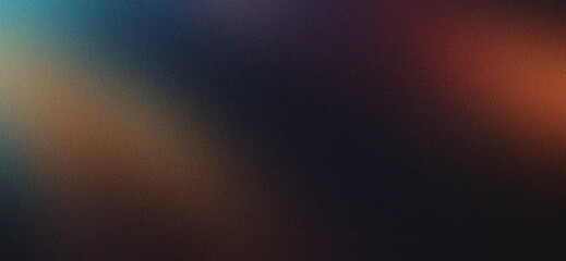 Abstract blurred grainy gradient background fading from blue to orange