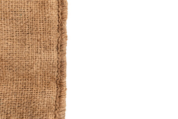 Burlap texture. A piece of torn burlap on a white background. Canvas. Packing material