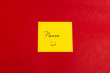 A yellow sticky note with the word 