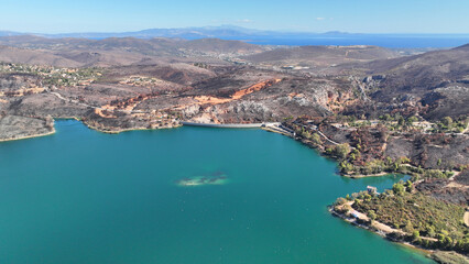 Aerial drone photo of lake and dam of Marathon after mega fires of Athens in August 2024, Attica,...