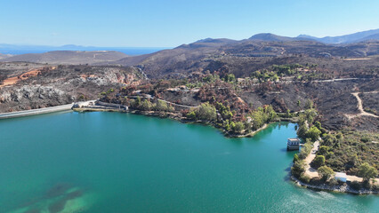 Aerial drone photo of lake and dam of Marathon after mega fires of Athens in August 2024, Attica, Greece