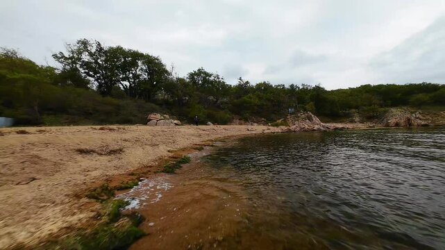 Aerial view over a small bay with a wild beach, located in the forest, Paraskeva Bay, Bulgaria