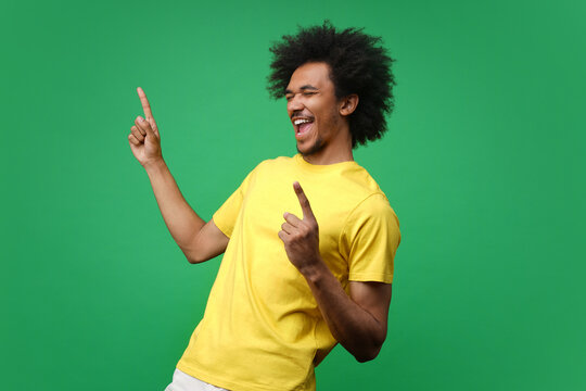 Ecstatic young football fan man cheering for his favorite team celebrating victory