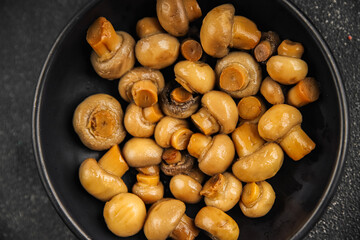 Champignon mushroom canned product tasty food dish fresh delicious gourmet food background on the table rustic food top view copy space top view keto and paleo diet Vegetarian and vegan food
