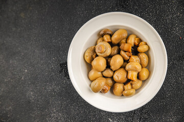 Champignon mushroom canned product tasty food dish fresh delicious gourmet food background on the table rustic food top view copy space top view keto and paleo diet Vegetarian and vegan food