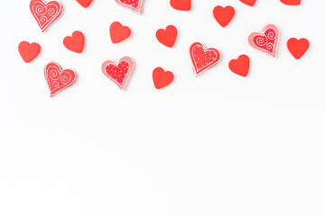 Overhead shot of red hearts on white background with copyspace. Flat lay