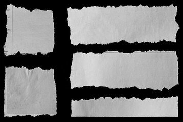 Torn papers on black