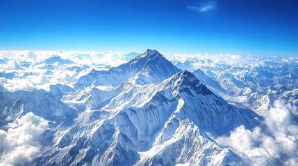 Naklejka premium The summit peak is framed by cloudy skies, casting an ethereal glow on the surrounding landscape