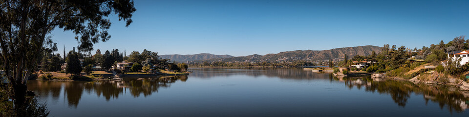 CORDOBA, ARGENTINA, MAY 5, 2022: Panoramic view of Saint Roque Lake in Villa Carlos Paz on a sunny day